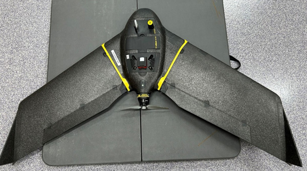 A black and yellow droneAI-generated content may be incorrect.